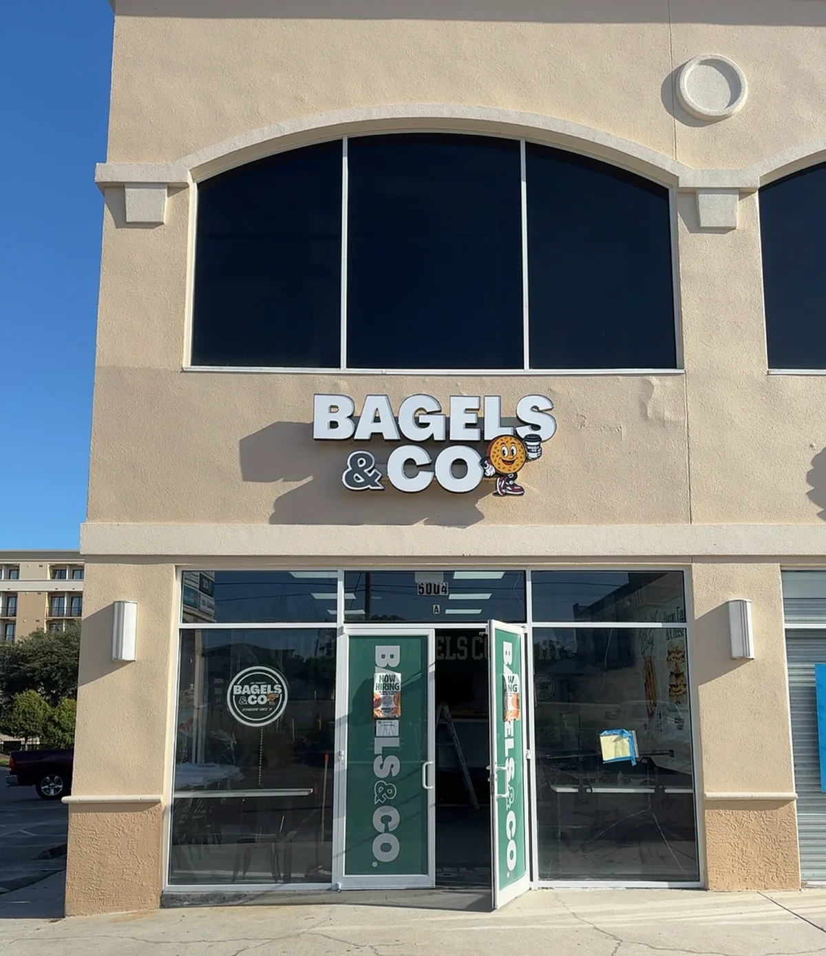 Bagels & Co face-lit channel letters and mascot logo on the Tampa storefront