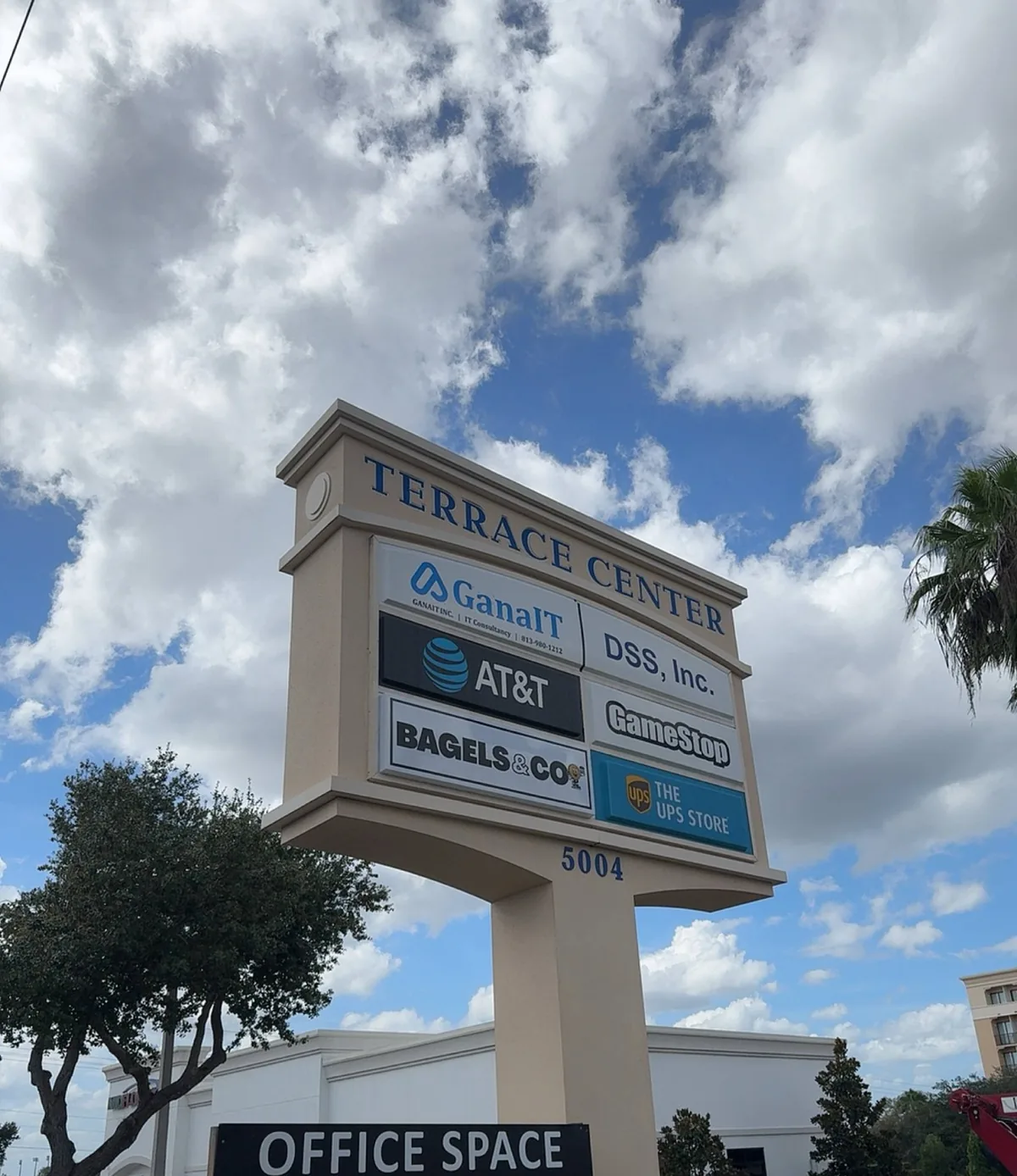 The Terrace Center pylon sign from below with the Bagels & Co panel installed