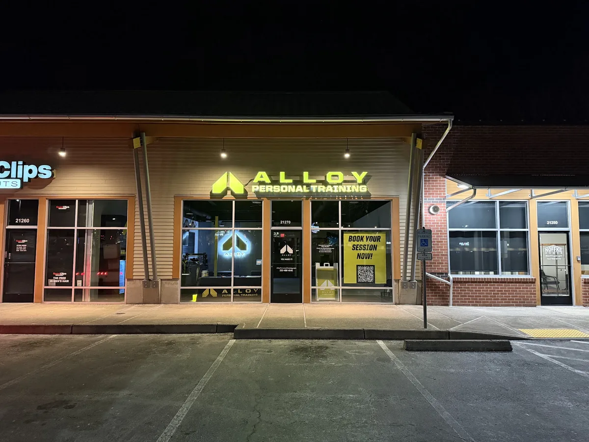 Alloy Personal Training face lit channel letters glowing at night