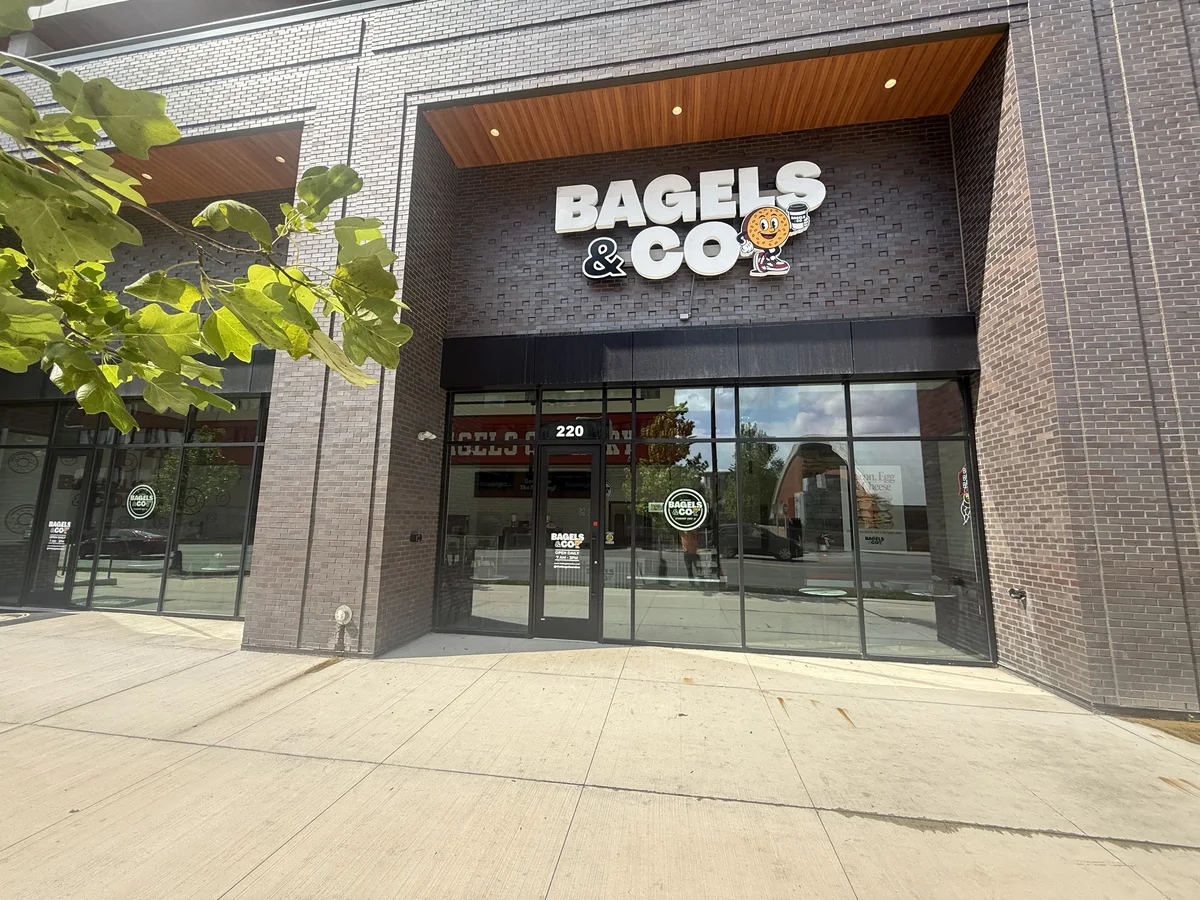 Bagels and Co channel letters on a brick storefront