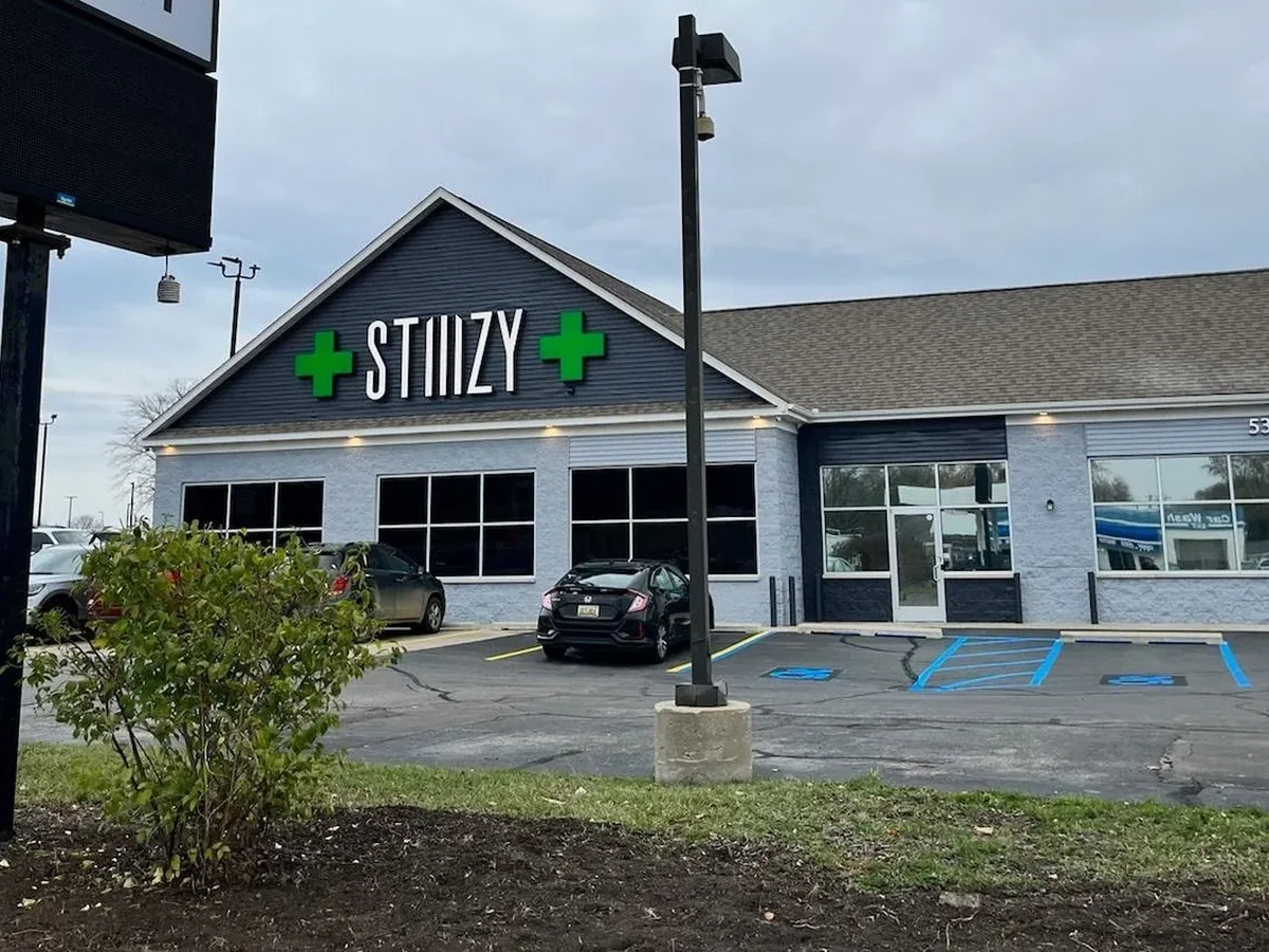 Stiiizy channel letters on a storefront gable