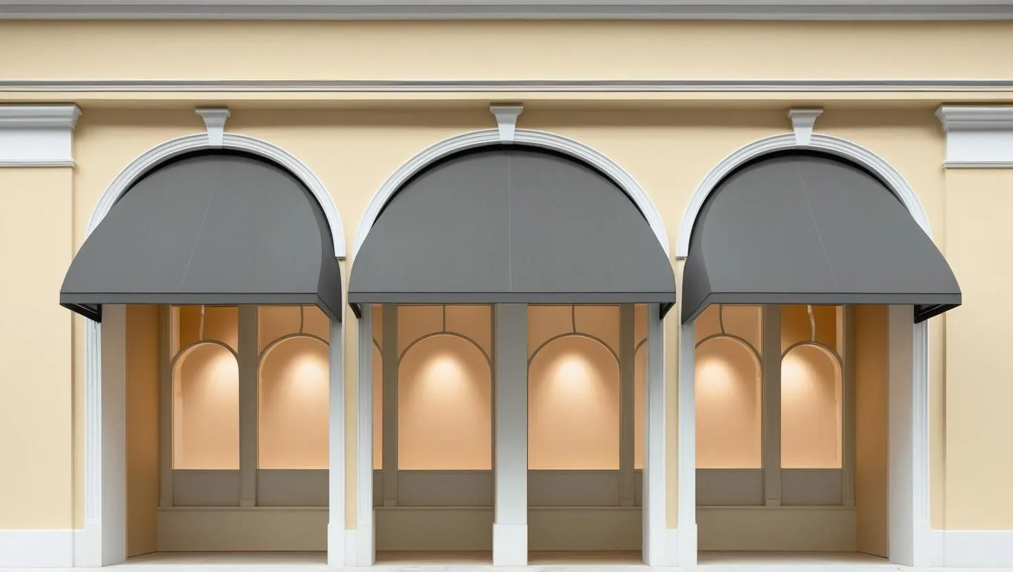 An arcaded storefront with awnings and no tenant signage