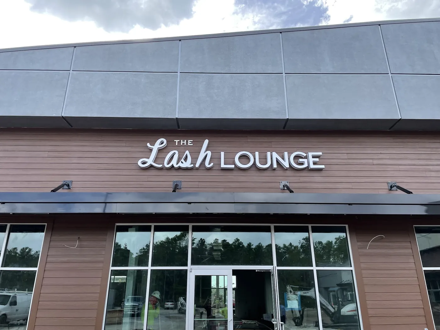 The Lash Lounge storefront signage in a retail center