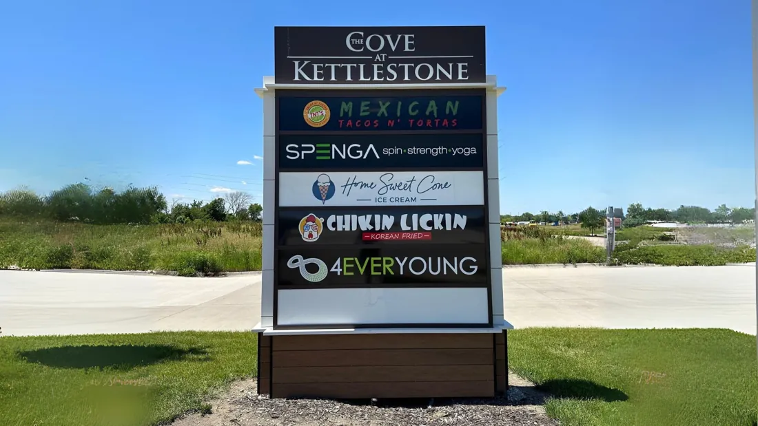 The Cove at Kettlestone multi tenant pylon sign listing restaurant and retail tenants