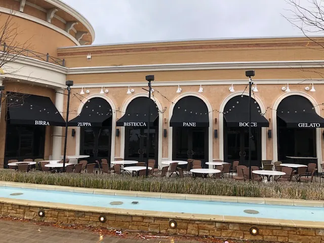 Branded awnings across a restaurant storefront