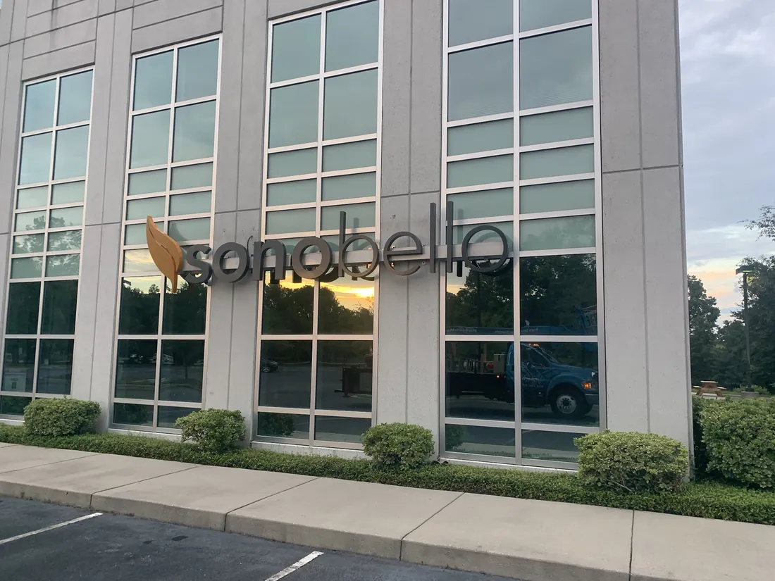 Reverse halo lit letters glowing against a building wall