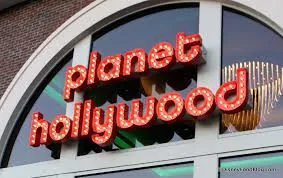 Illuminated Planet Hollywood storefront signage