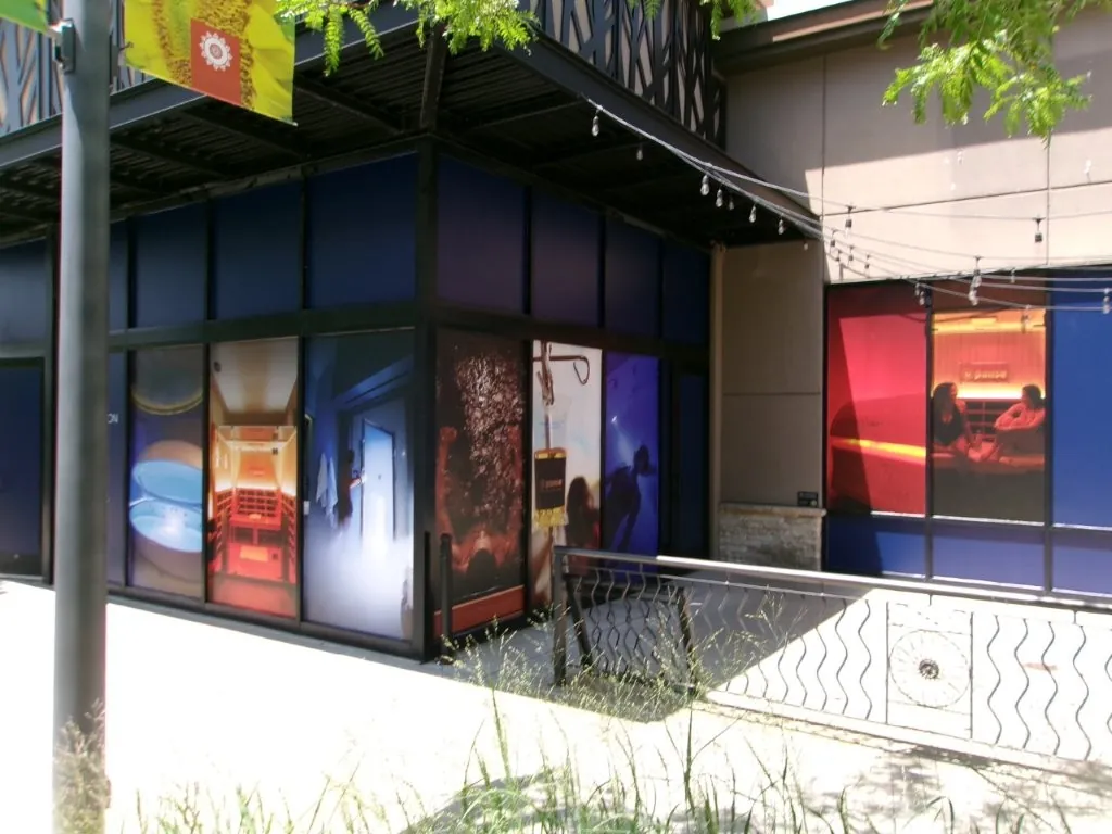 Window graphics announcing a store opening