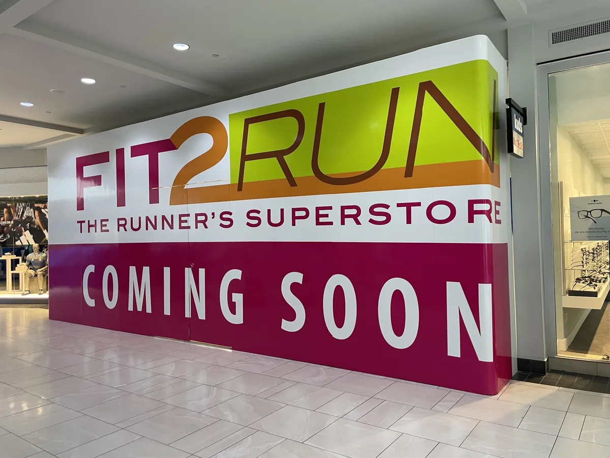 Fit2Run printed barricade graphics wrapping a site