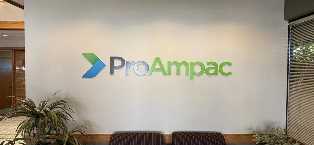 The same lobby wall after the rebrand with the ProAmpac logo