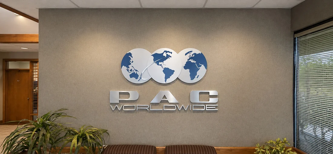 The PAC Worldwide lobby wall letters before the rebrand