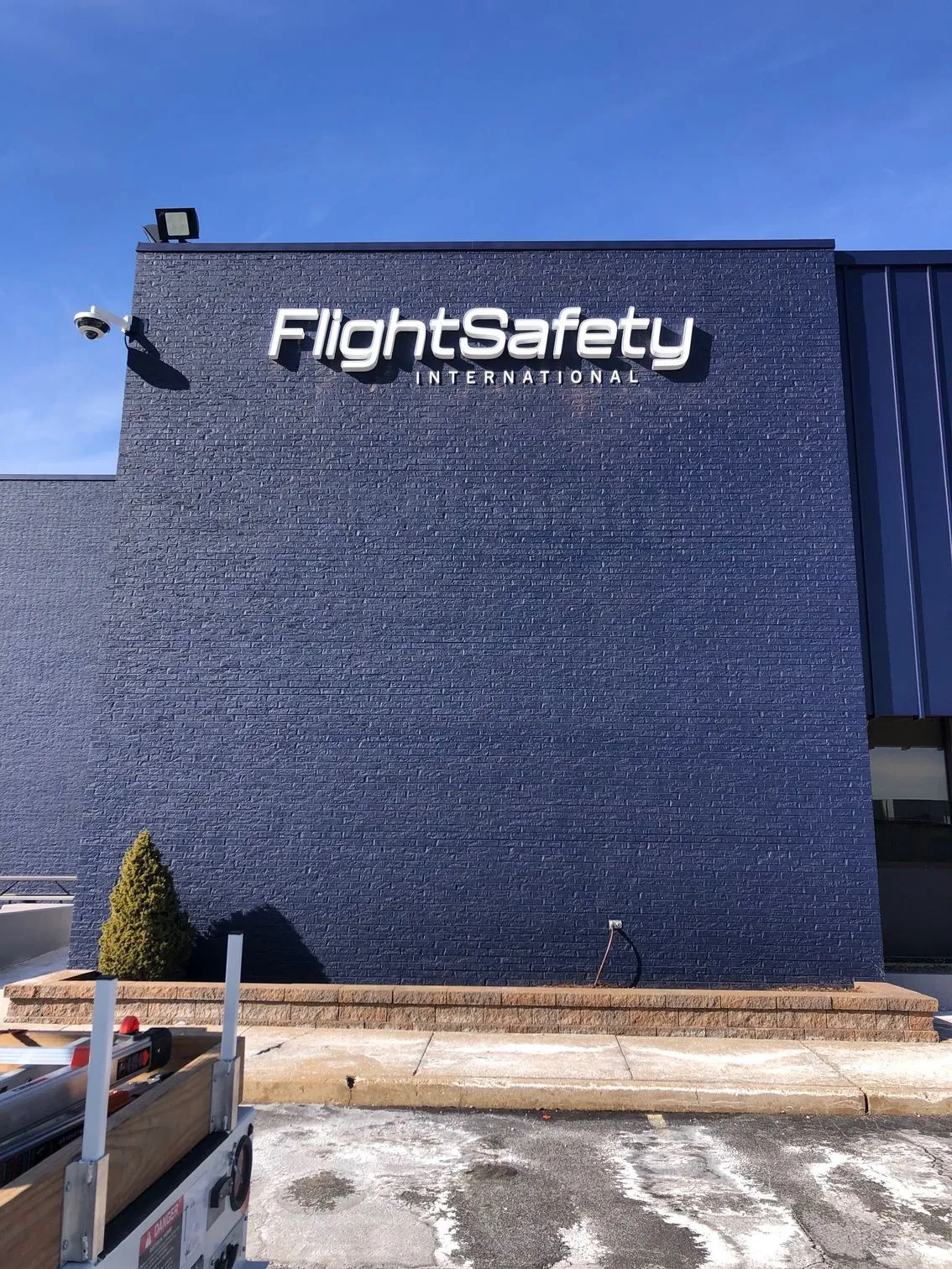 A blue building with a sign that says flightsafety international