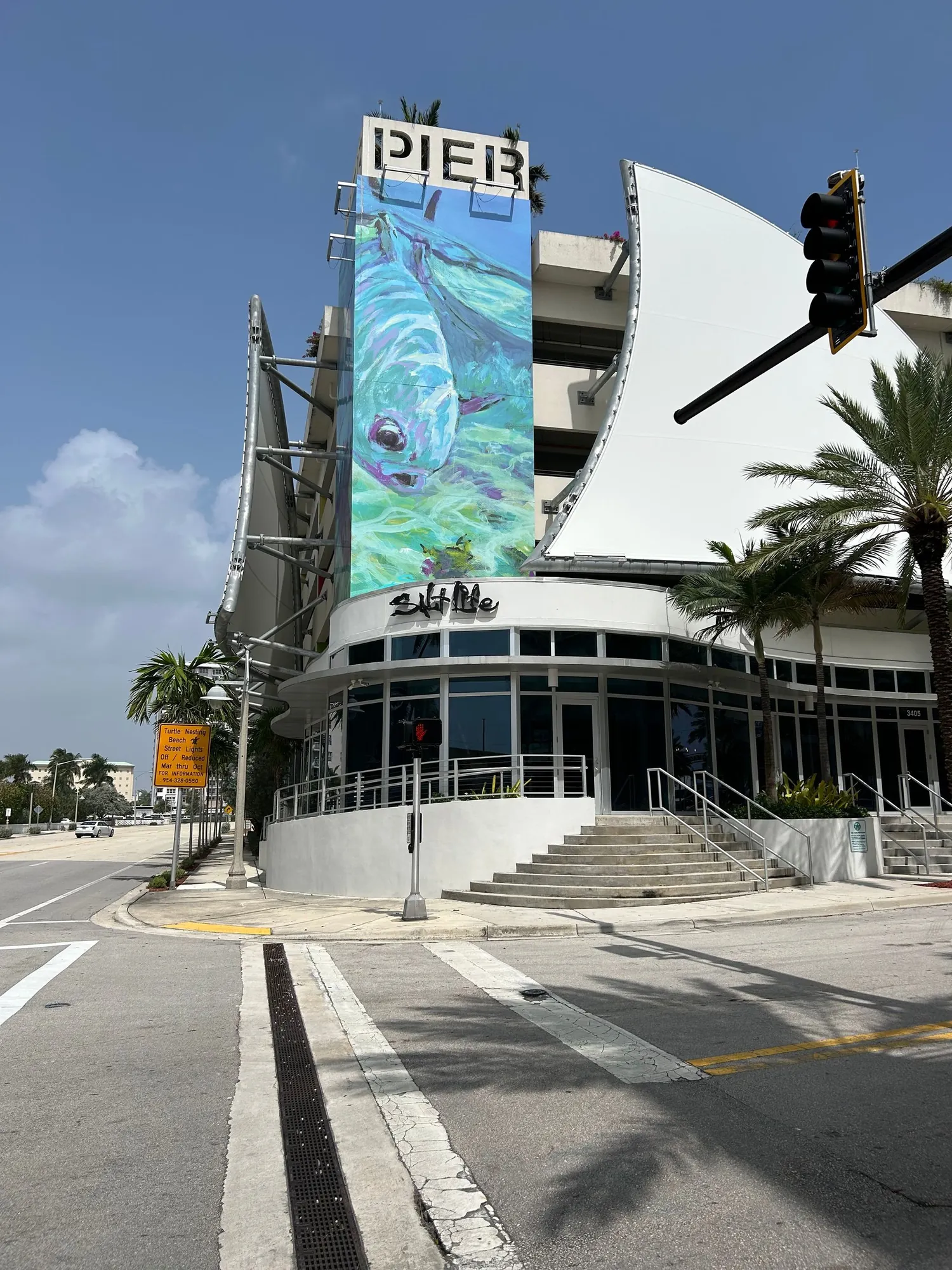 A pier building with a large mural on the side